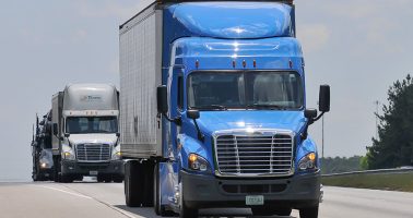 Two-Semi-Trucks-On-Road.jpg